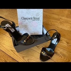 Woman’s black leather heeled sandals